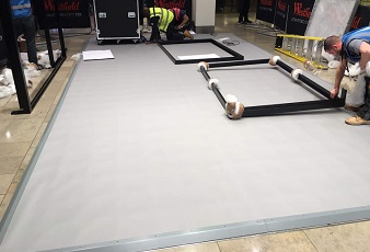 A raised platform with powder coated ramp